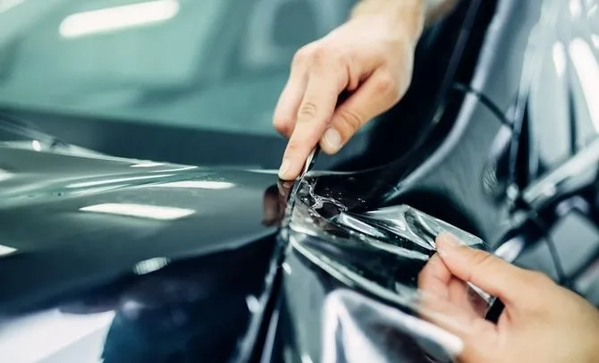 Paint protection film applied to a vehicle bonnet