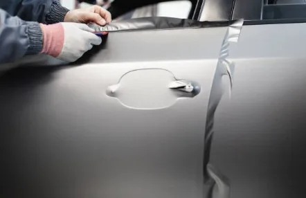 Vinyl wrap being fitted to a vehicle